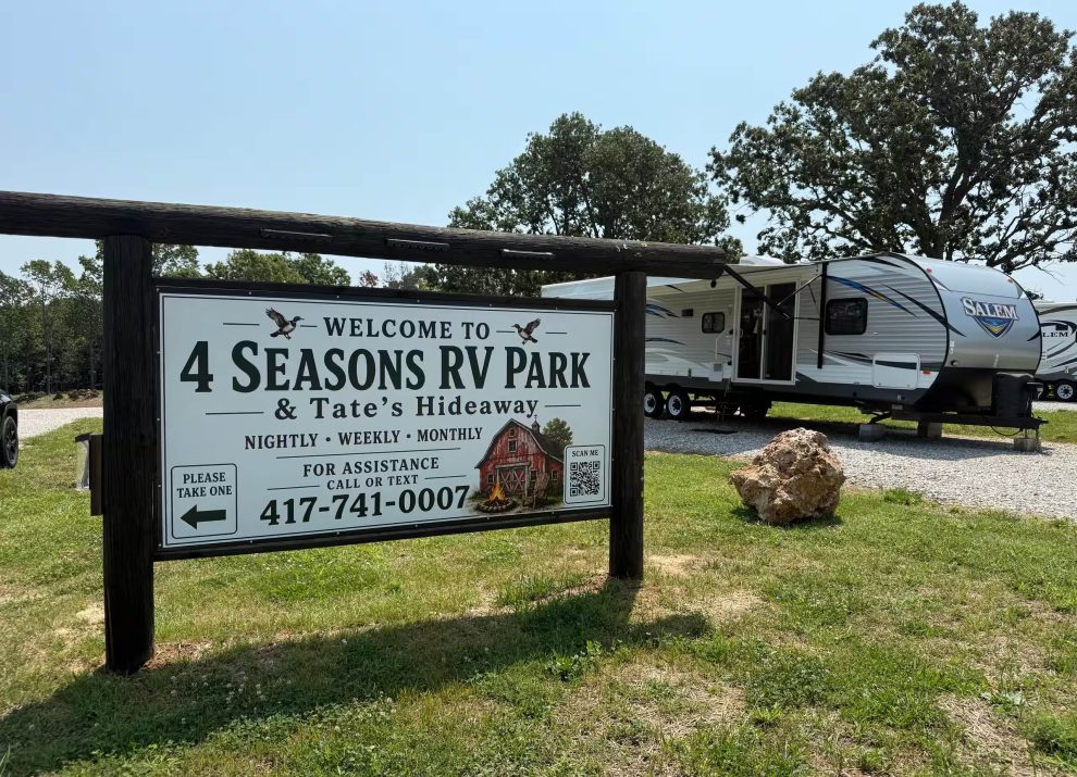Randy’s Rest Stop camper beside the 4 Seasons RV Park sign in Mansfield, Missouri